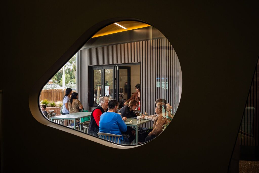 Red Feather cafe customers sitting with food and drink